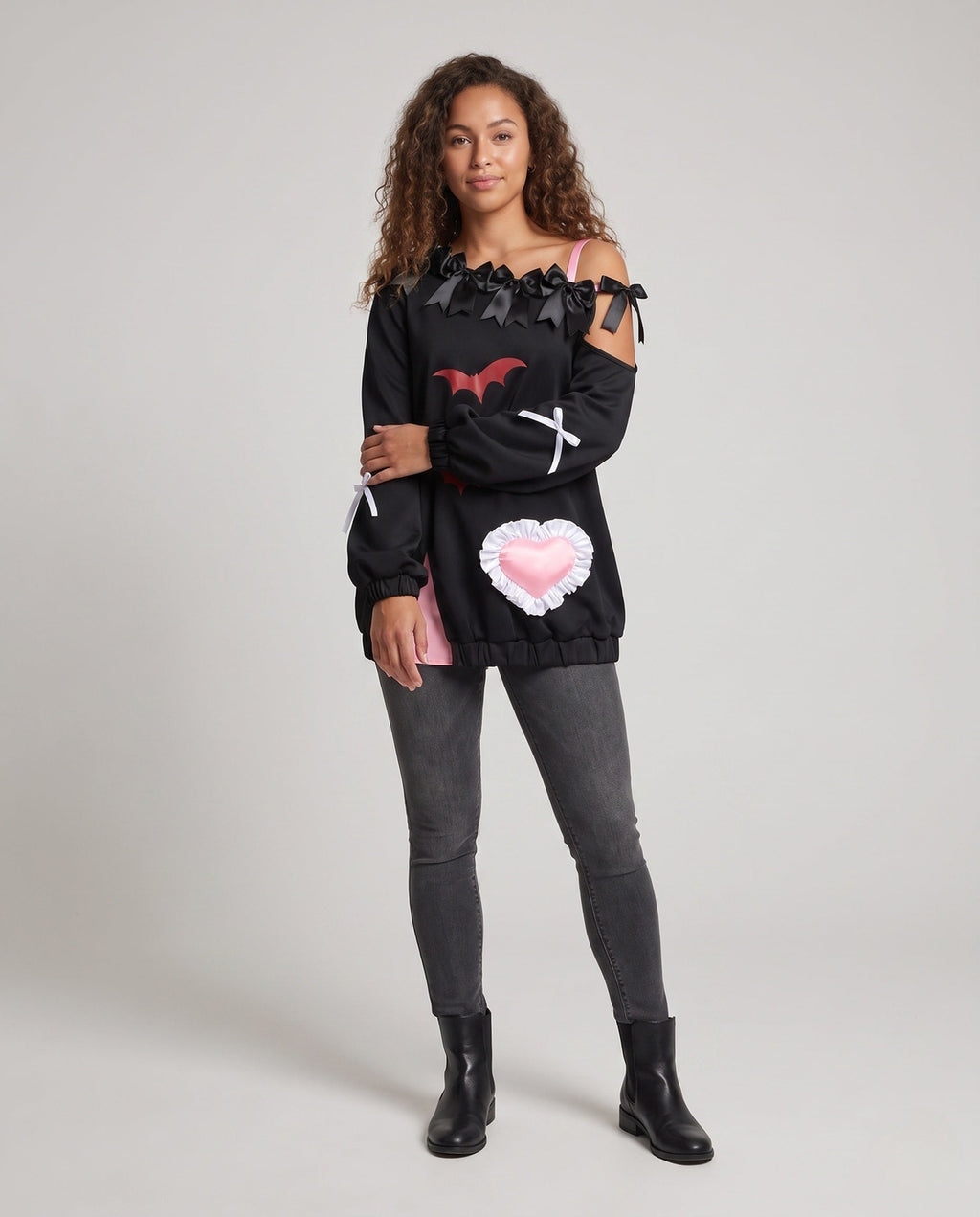 Black cold-shoulder Halloween sweatshirt with satin bows, red bat prints and pink ruffled heart