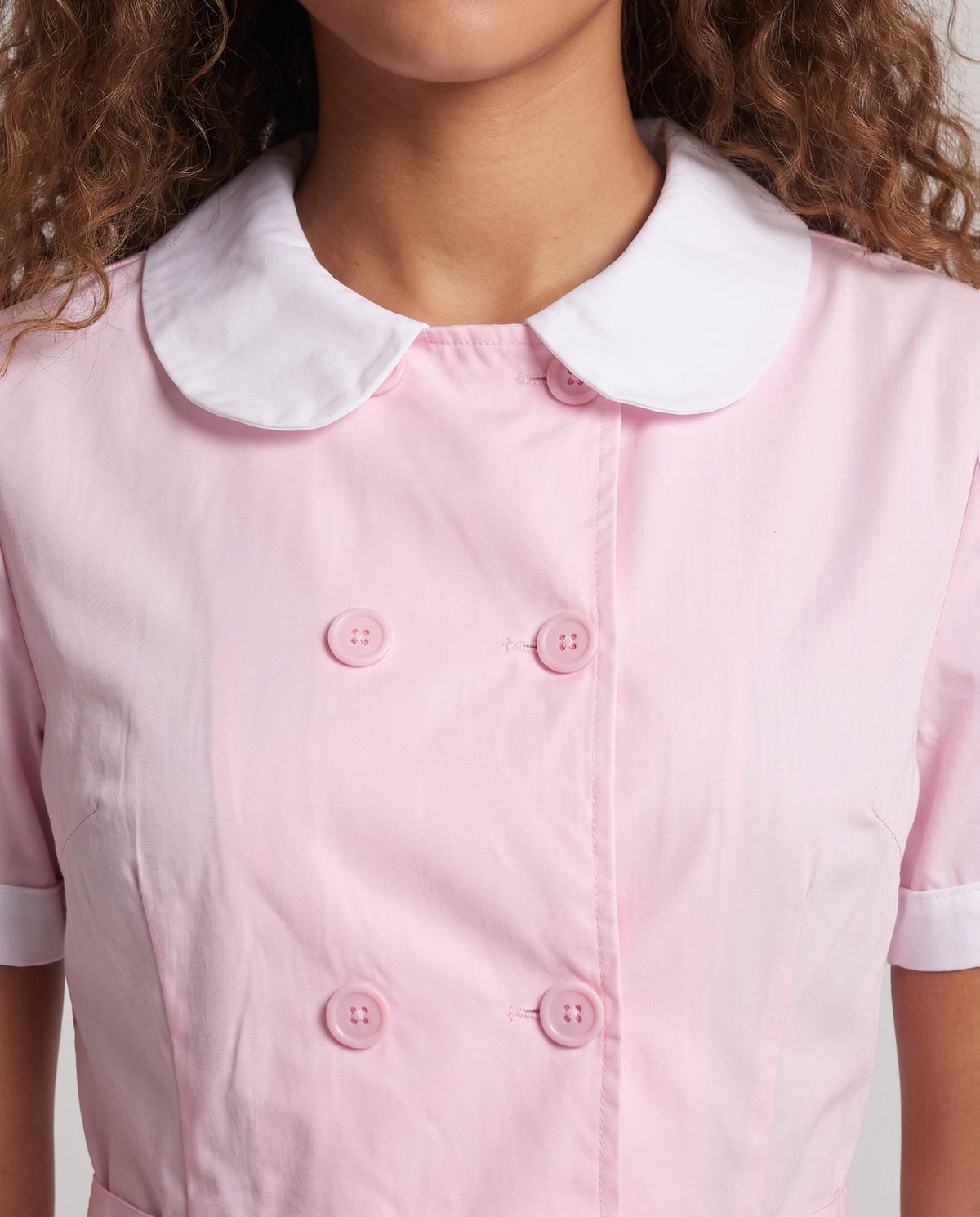 Women's pink nurse Halloween costume dress with white Peter Pan collar and pleated mini skirt - view 2