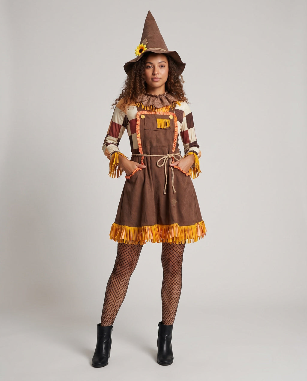 Women's scarecrow Halloween costume with pointed hat, patchwork sleeves and fringe trim