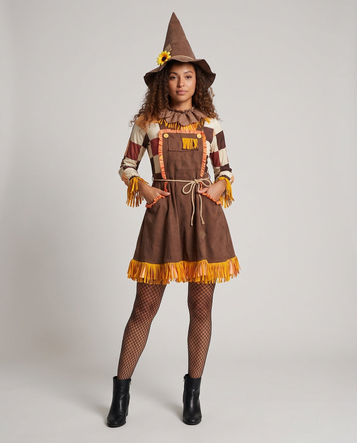 Women's scarecrow Halloween costume with pointed hat, patchwork sleeves and fringe trim