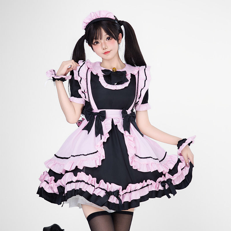 Black and pink ruffled maid Halloween costume dress with apron and bows