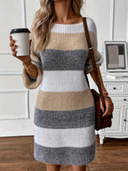 Woman wearing an oversized white, taupe and gray striped sweater dress with balloon sleeves - view 3