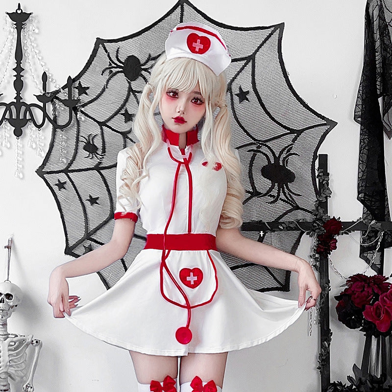 Women's white nurse Halloween costume mini dress with red trim, heart apron and matching nurse cap - view 2