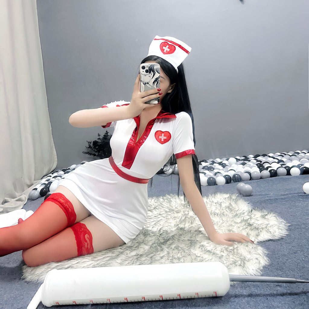 Women's white nurse Halloween costume mini dress with glossy red trim and red lace-top stockings - view 4