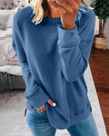 Women's relaxed crewneck sweatshirt with exposed seams and split curved hem