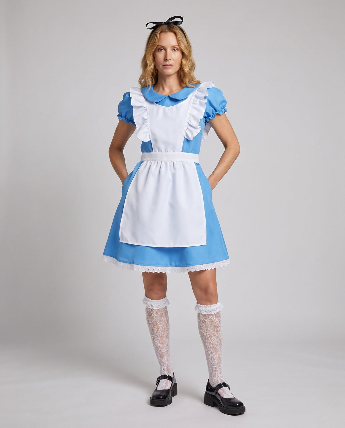 Woman wearing a blue fairytale costume dress with a white ruffled apron and Peter Pan collar