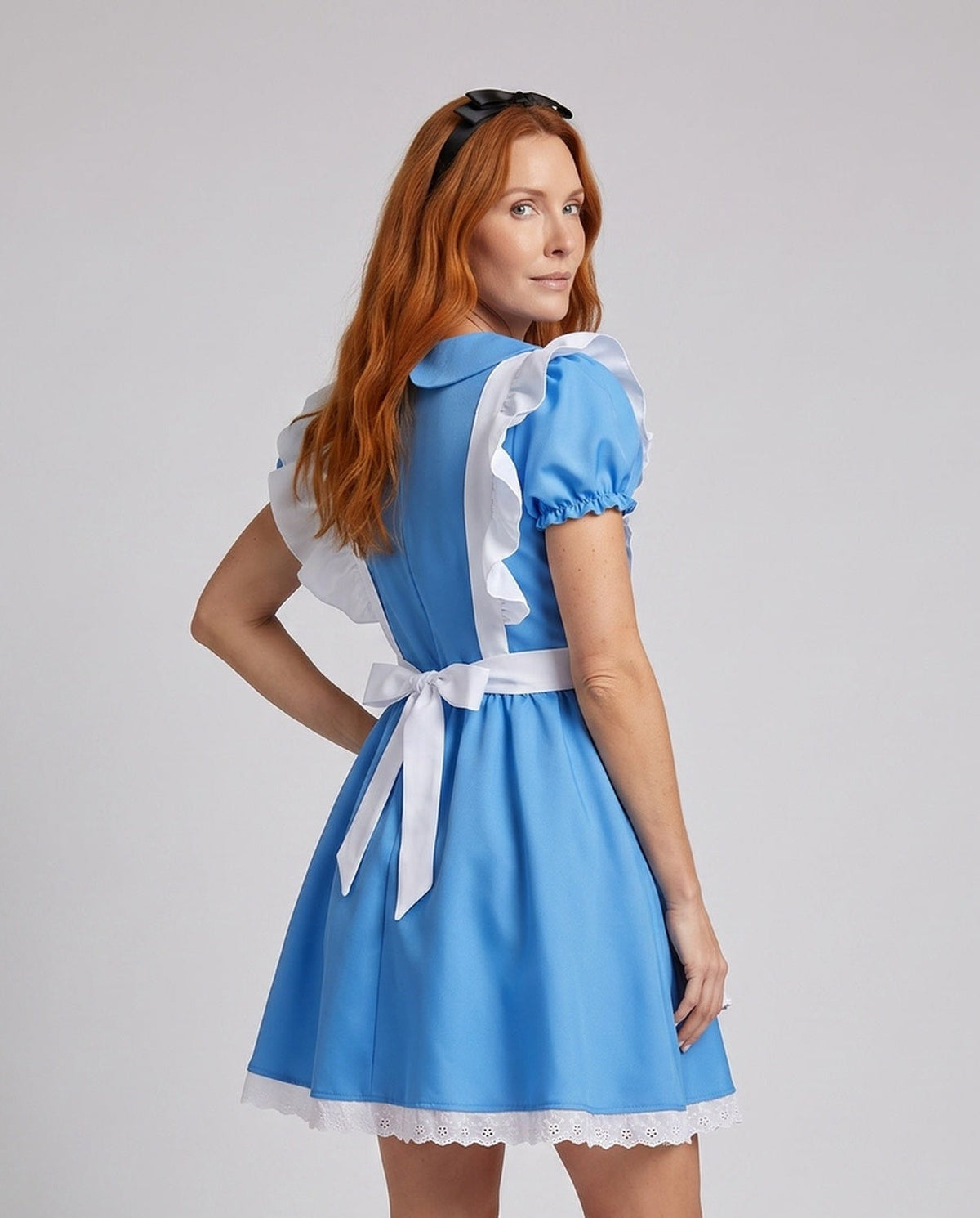 Woman wearing a blue fairytale costume dress with a white ruffled apron and Peter Pan collar - view 4
