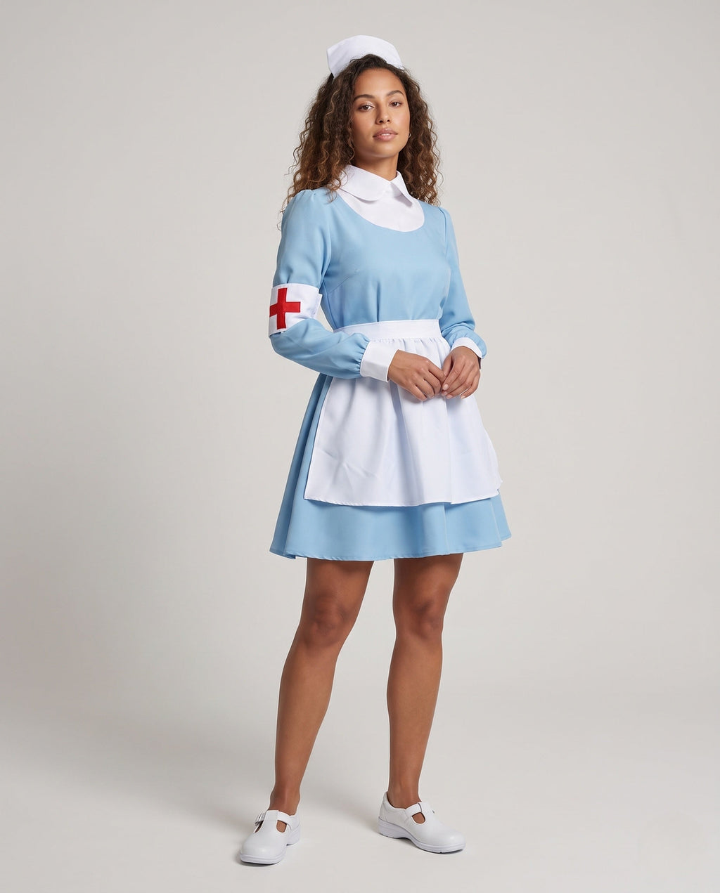 Women's light blue nurse costume with white apron, nurse cap and red cross armband