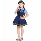 Girl wearing navy police costume dress with light blue puff sleeves, black tie, belt and gold-striped pleated skirt - view 2
