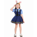 Girl wearing navy police costume dress with light blue puff sleeves, black tie, belt and gold-striped pleated skirt - view 7