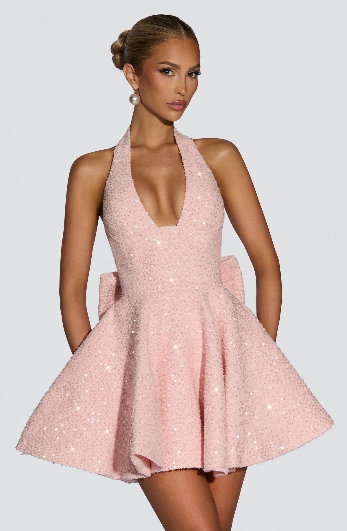Pink sequin halter homecoming mini dress with oversized back bow
