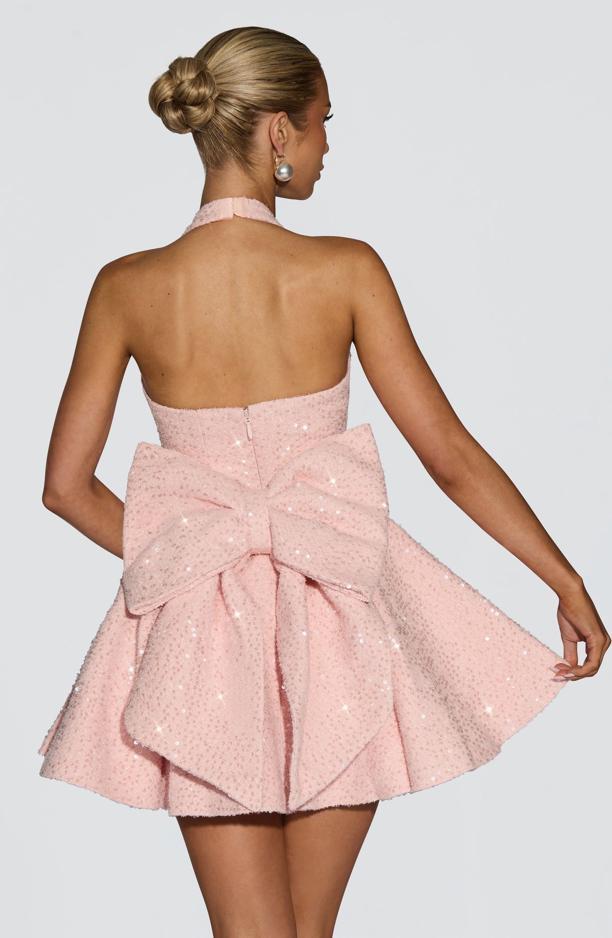 Pink sequin halter homecoming mini dress with oversized back bow - view 2
