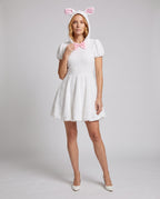 White plush hooded bunny costume dress with pink-lined ears and pink bow