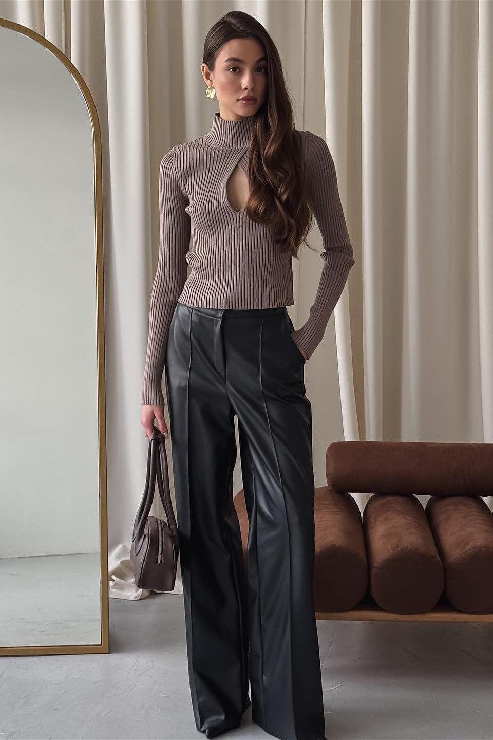 Woman wearing brown ribbed knit turtleneck sweater with keyhole cutout - view 5