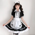 Women's black and white maid Halloween costume with ruffled apron, puff sleeves and headpiece