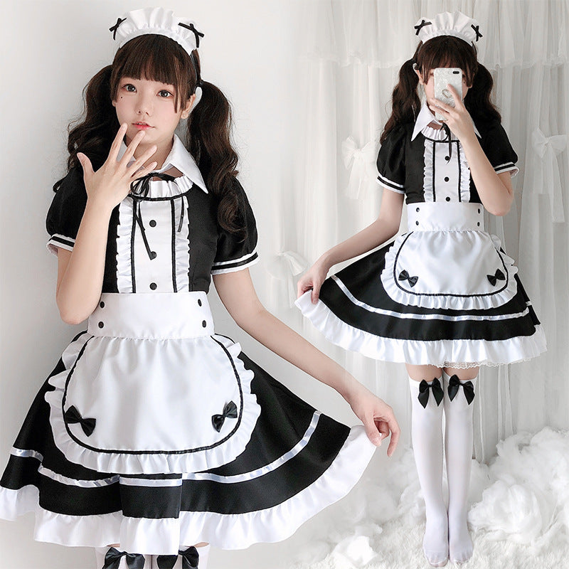 Women's black and white maid Halloween costume with ruffled apron, puff sleeves and headpiece - view 2