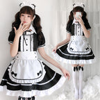 Women's black and white maid Halloween costume with ruffled apron, puff sleeves and headpiece - view 2
