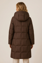 Longline quilted puffer jacket with hood and side pockets on model - view 3