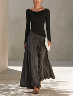 Holiday long sleeve maxi dress with draped black bodice and charcoal pleated skirt