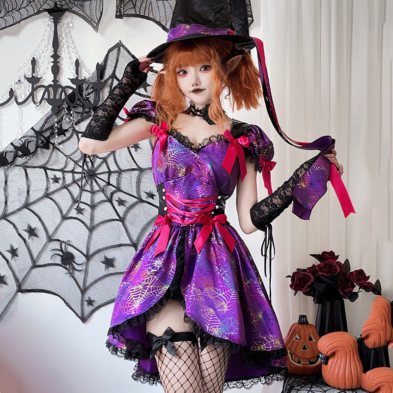 Woman wearing a purple spiderweb print witch costume dress with pink bows, lace-up waist and black lace trim