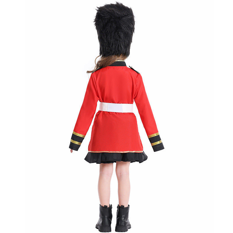 Girl wearing a red royal guard Halloween costume with gold trim, white belt, black skirt and tall black faux fur hat - view 4