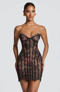 Strapless black lace corset homecoming mini dress with nude underlay and lace-up back
