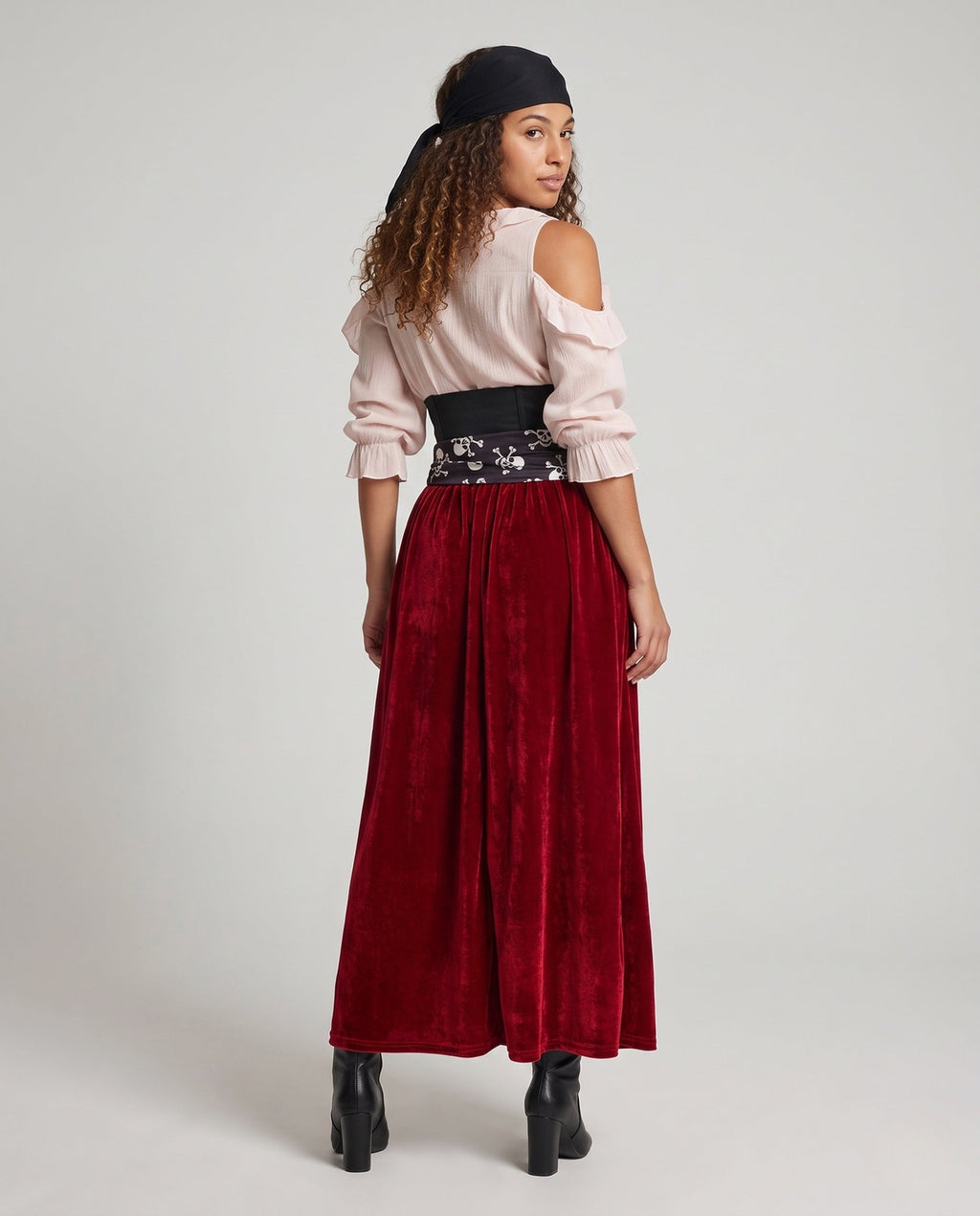 Women's pirate costume with blush lace-up cold-shoulder blouse, black corset belt, skull print sash and wine velvet maxi skirt - view 3
