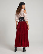 Women's pirate costume with blush lace-up cold-shoulder blouse, black corset belt, skull print sash and wine velvet maxi skirt - view 3