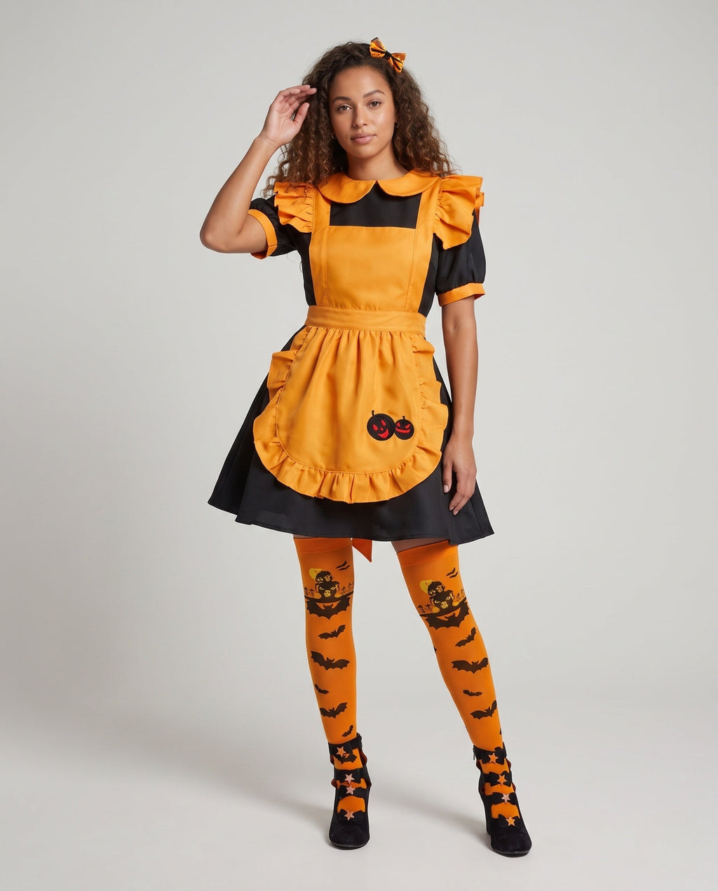 Women's orange and black Halloween costume dress with ruffled pumpkin apron and Peter Pan collar