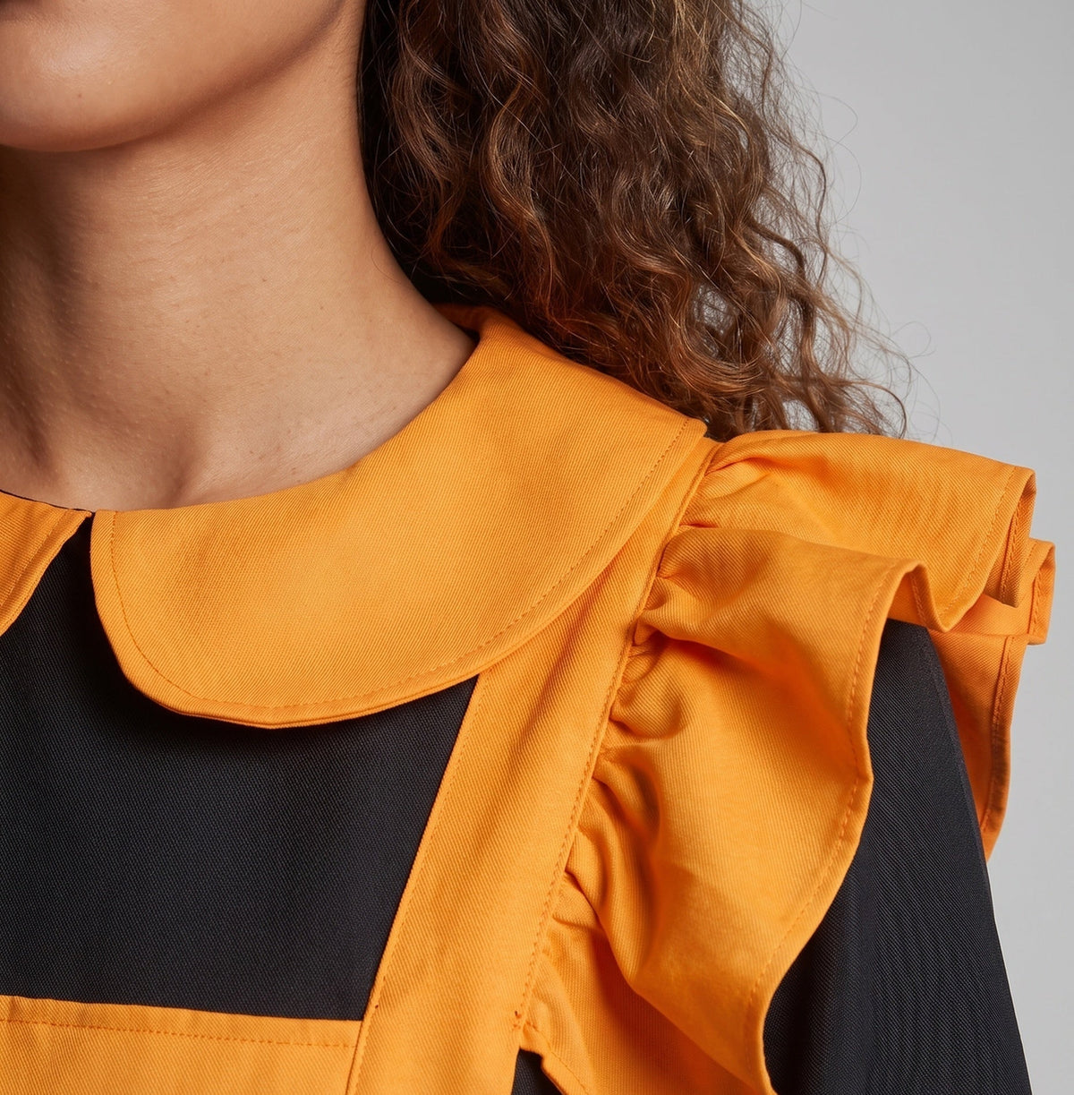 Women's orange and black Halloween costume dress with ruffled pumpkin apron and Peter Pan collar - view 2