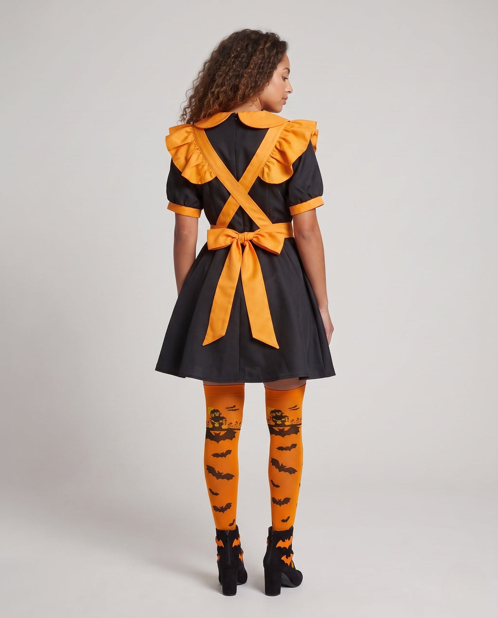 Women's orange and black Halloween costume dress with ruffled pumpkin apron and Peter Pan collar - view 3