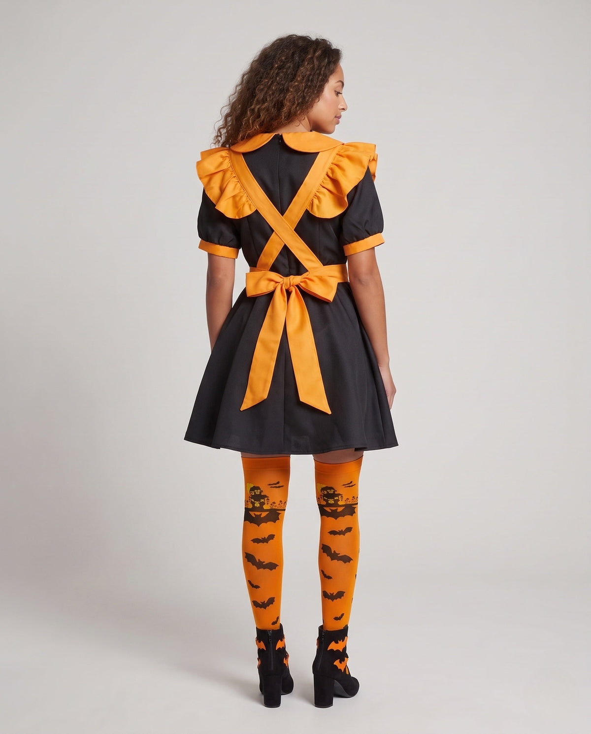Women's orange and black Halloween costume dress with ruffled pumpkin apron and Peter Pan collar - view 3