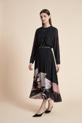 Black long sleeve midi dress with sheer sleeves, gold buttons and pleated skirt with pink and ivory floral hem print