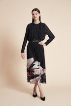 Black long sleeve midi dress with sheer sleeves, gold buttons and pleated skirt with pink and ivory floral hem print - view 2