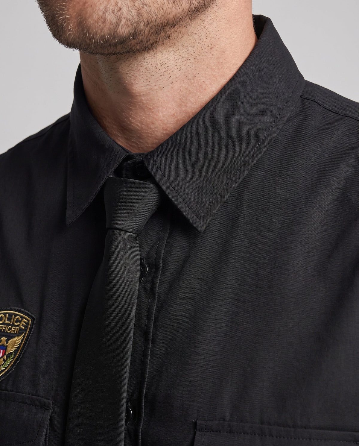 Men's black police Halloween costume with sleeveless shirt, tie and peaked hat - view 2