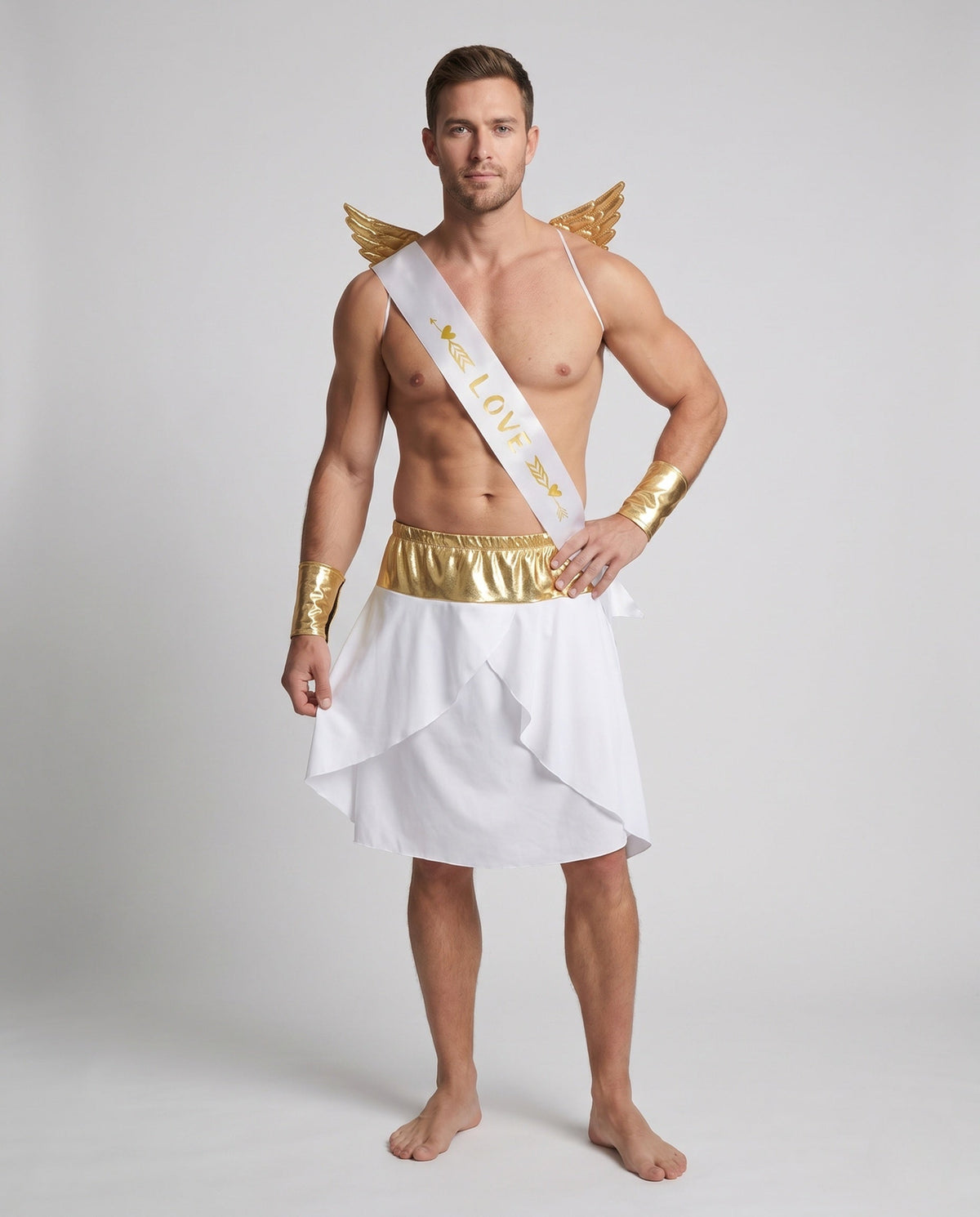 Men's Cupid Halloween costume with white wrap skirt, gold waistband, gold wings, LOVE sash and gold cuffs