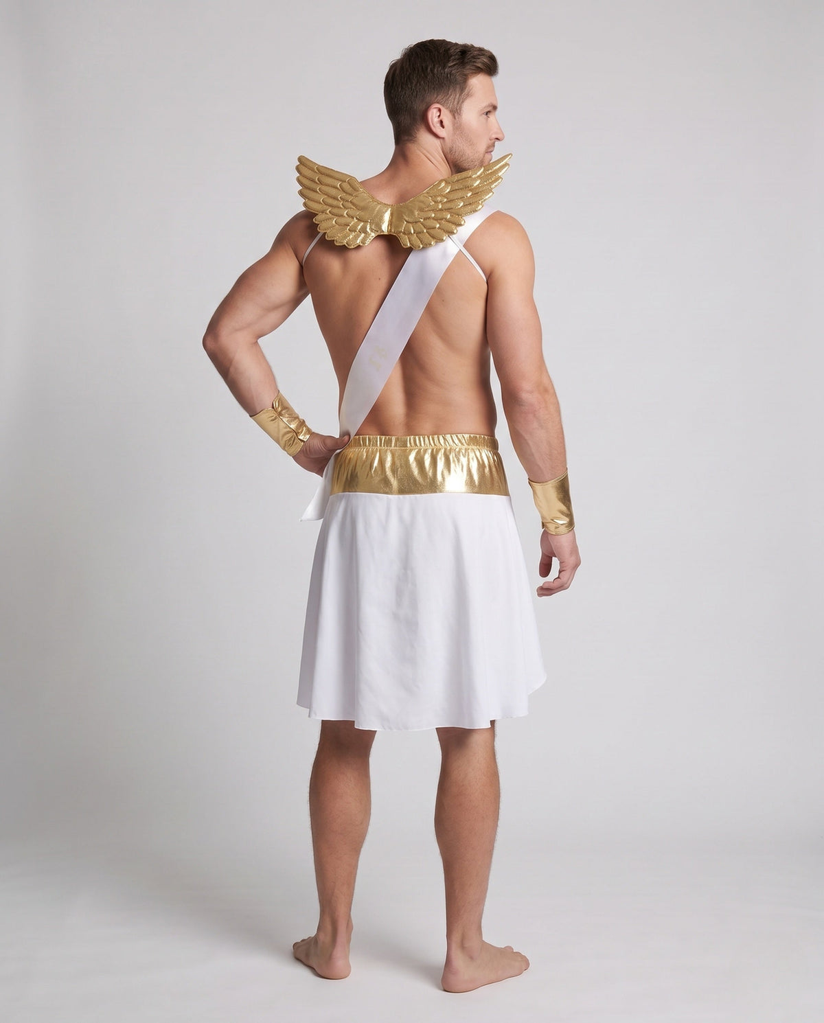 Men's Cupid Halloween costume with white wrap skirt, gold waistband, gold wings, LOVE sash and gold cuffs - view 3