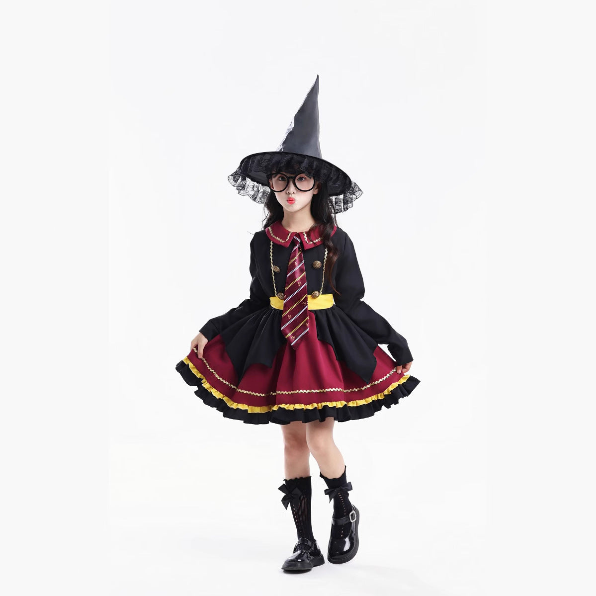 Girl wearing a black and burgundy witch costume with a pointed hat and striped tie - view 2