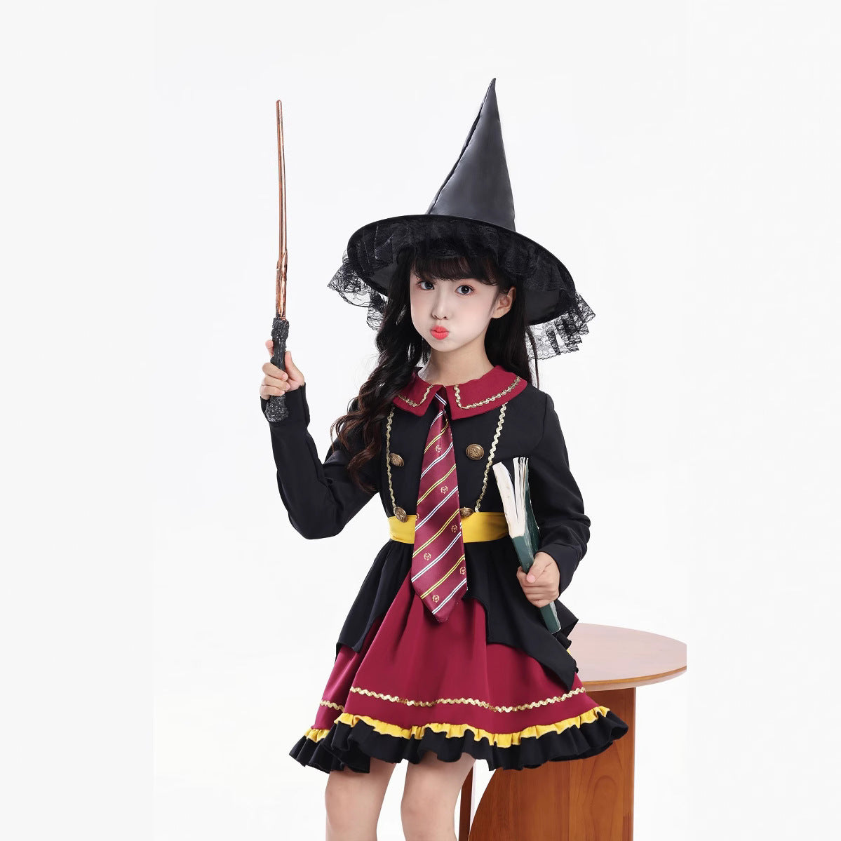 Girl wearing a black and burgundy witch costume with a pointed hat and striped tie - view 7