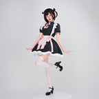Women's black maid Halloween costume with heart cutout, white ruffled apron and pink bows - view 4