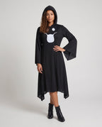 Woman wearing a black hooded Halloween costume dress with a white ghost face, bell sleeves and a handkerchief hem