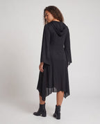Woman wearing a black hooded Halloween costume dress with a white ghost face, bell sleeves and a handkerchief hem - view 4