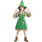 Girl wearing a green scarecrow Halloween costume with patchwork sleeves, fringe trim, rope belt and sunflower hat - view 2