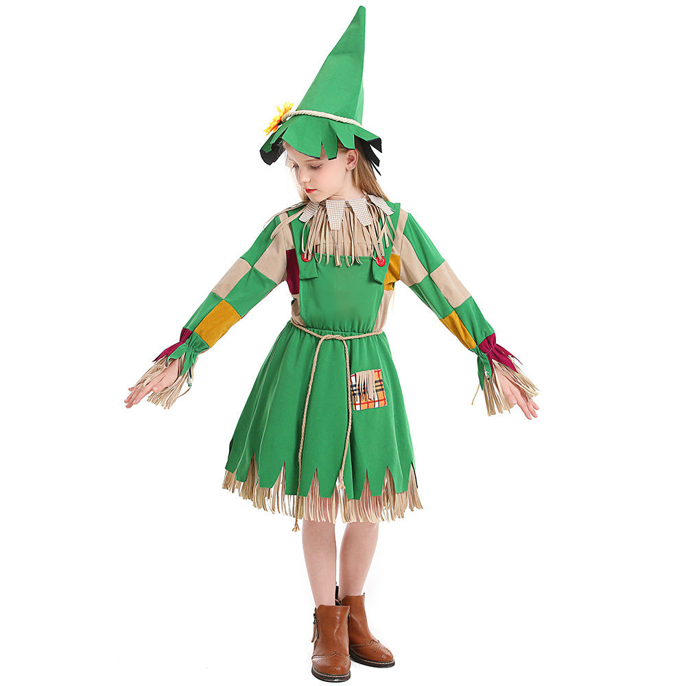 Girl wearing a green scarecrow Halloween costume with patchwork sleeves, fringe trim, rope belt and sunflower hat - view 5