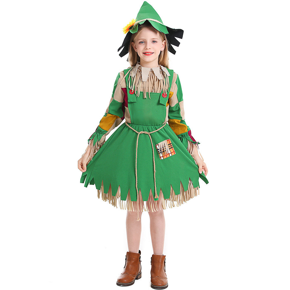 Girl wearing a green scarecrow Halloween costume with patchwork sleeves, fringe trim, rope belt and sunflower hat - view 6