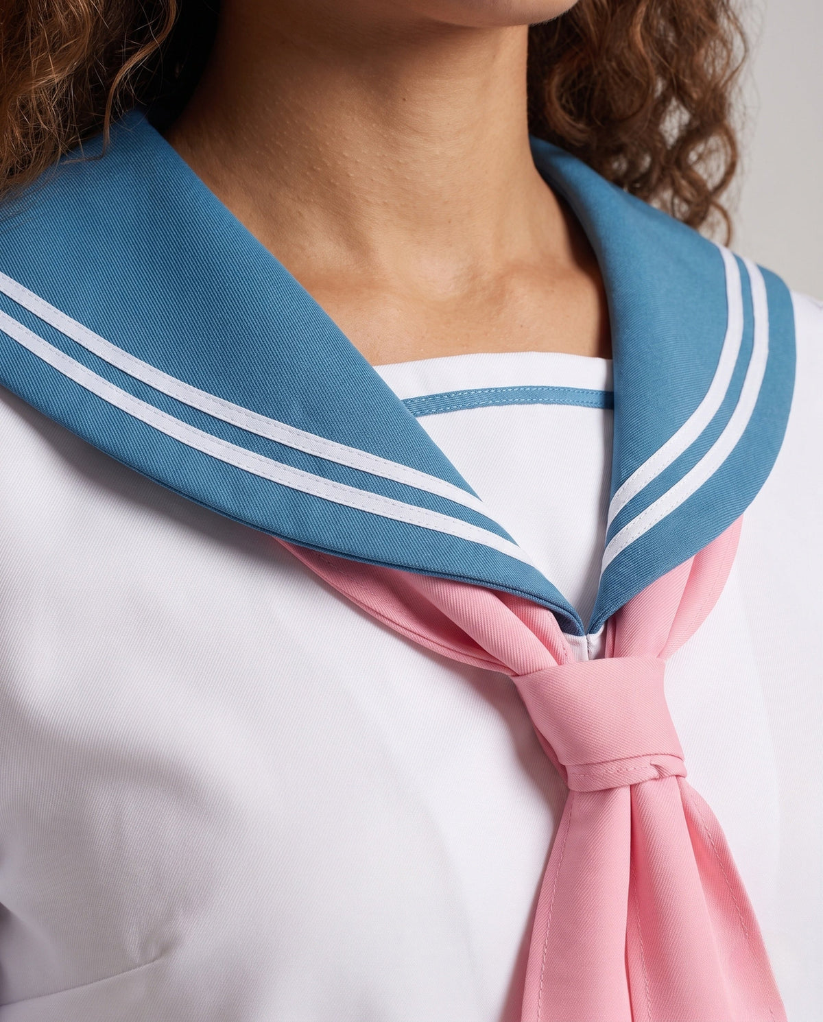 Women's bunny sailor Halloween costume with blue sailor collar, pink neck scarf and pleated mini skirt - view 3