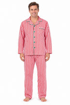 Family wearing matching red and white candy cane striped button-up Christmas pajamas with green piping - view 6