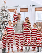 Family in matching red and white striped Christmas pajamas with gray ribbed cuffs - view 5