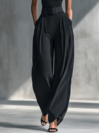 Woman in black one-shoulder top and pleated wide leg pants set - view 4