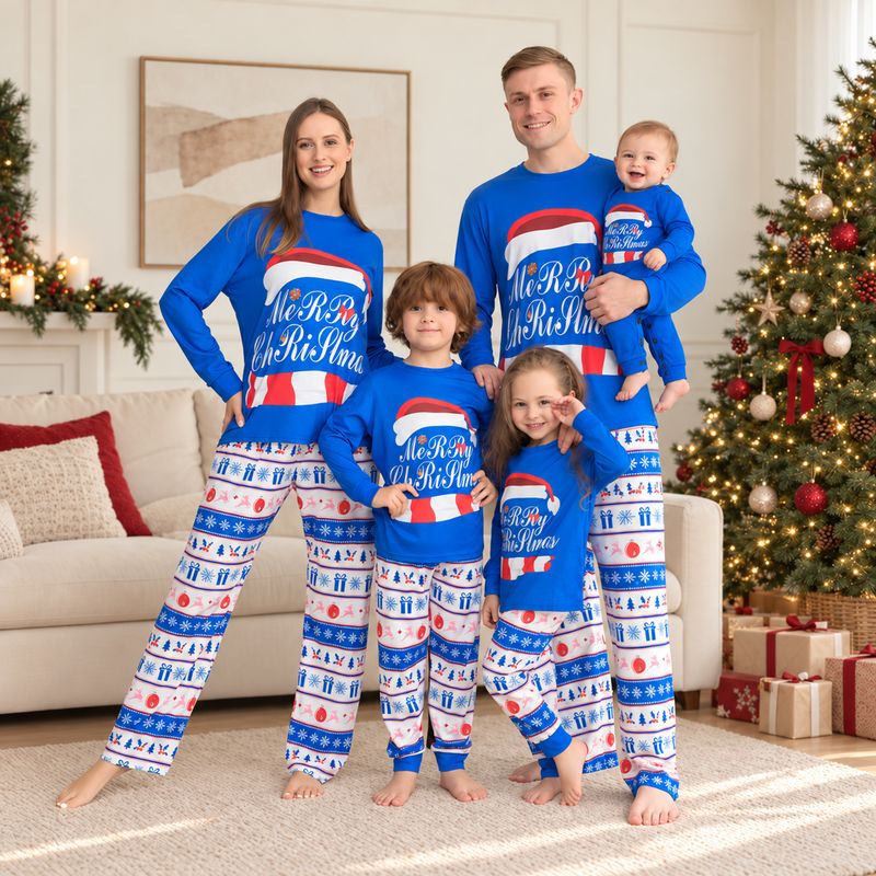 Family wearing blue Christmas pajamas with Santa hat graphic and snowflake print pants
